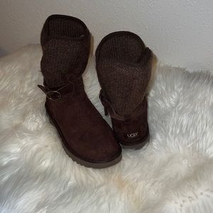 Chocolate brown UGGs with adjustable sidestrap and knit upper.